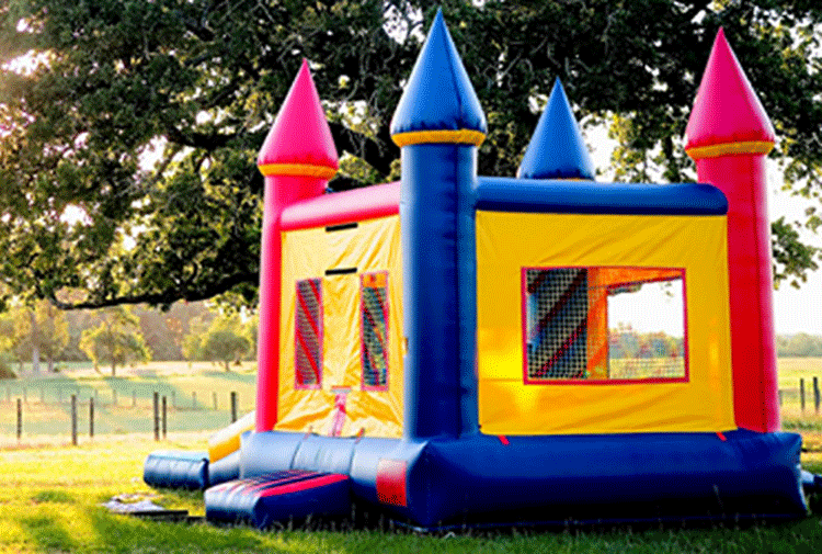 Photo of bounce house at wedding reception