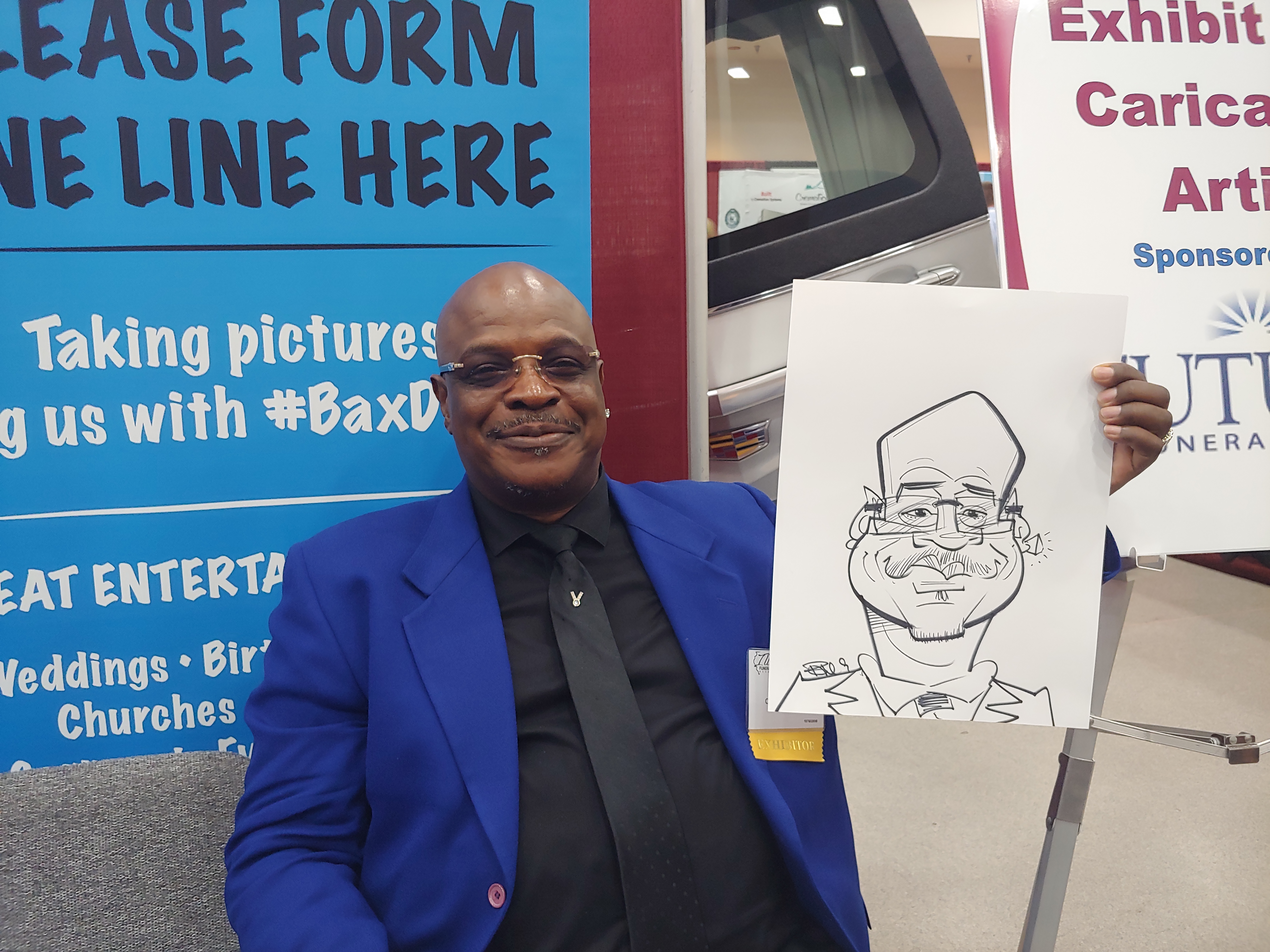Man holding caricature at Gateway Center Collinsville during the Illinois Funeral Directors Association Conference