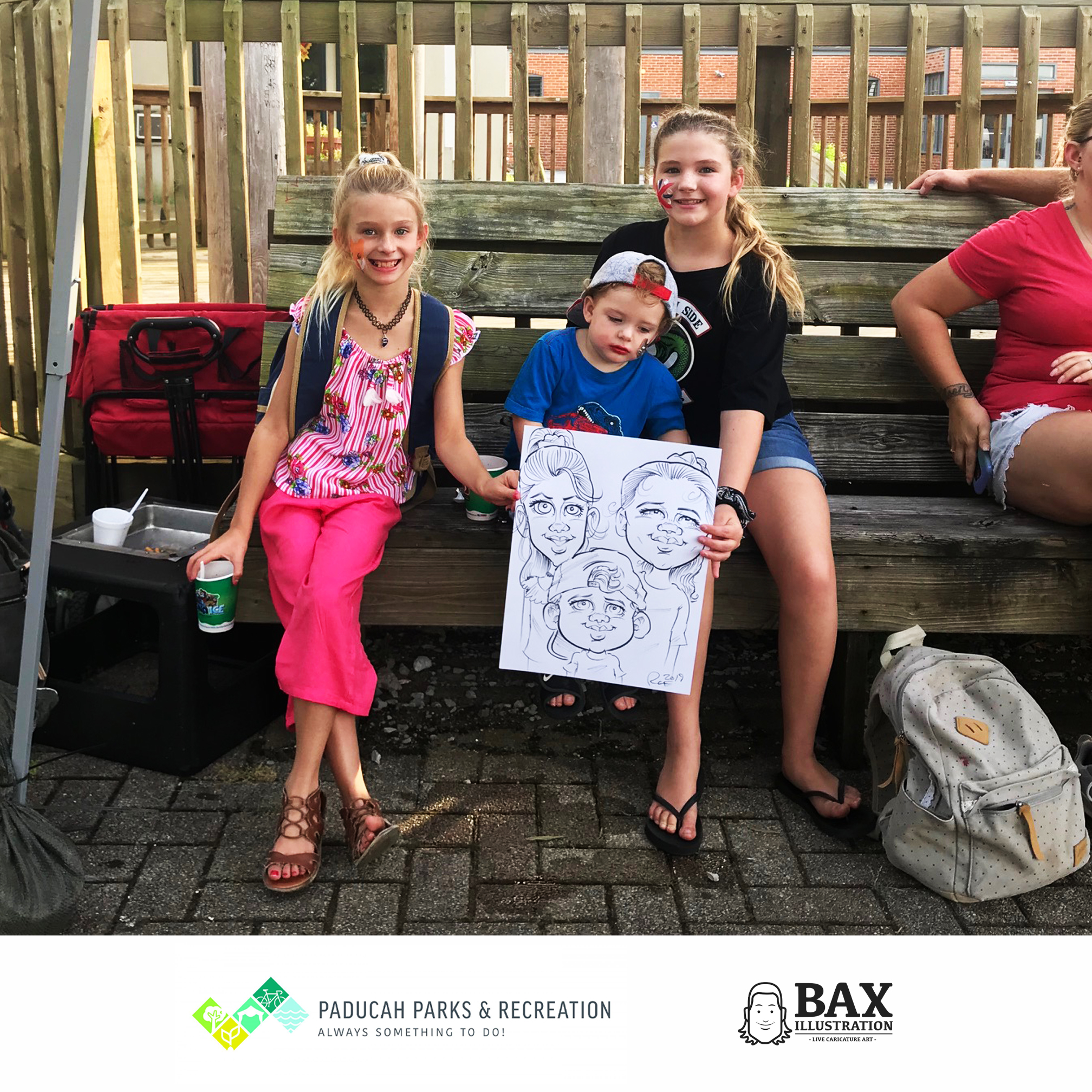 Kids holding caricature by Bax Illustration in Paducah Kentucky at the 2019 Independence Day Celebration
