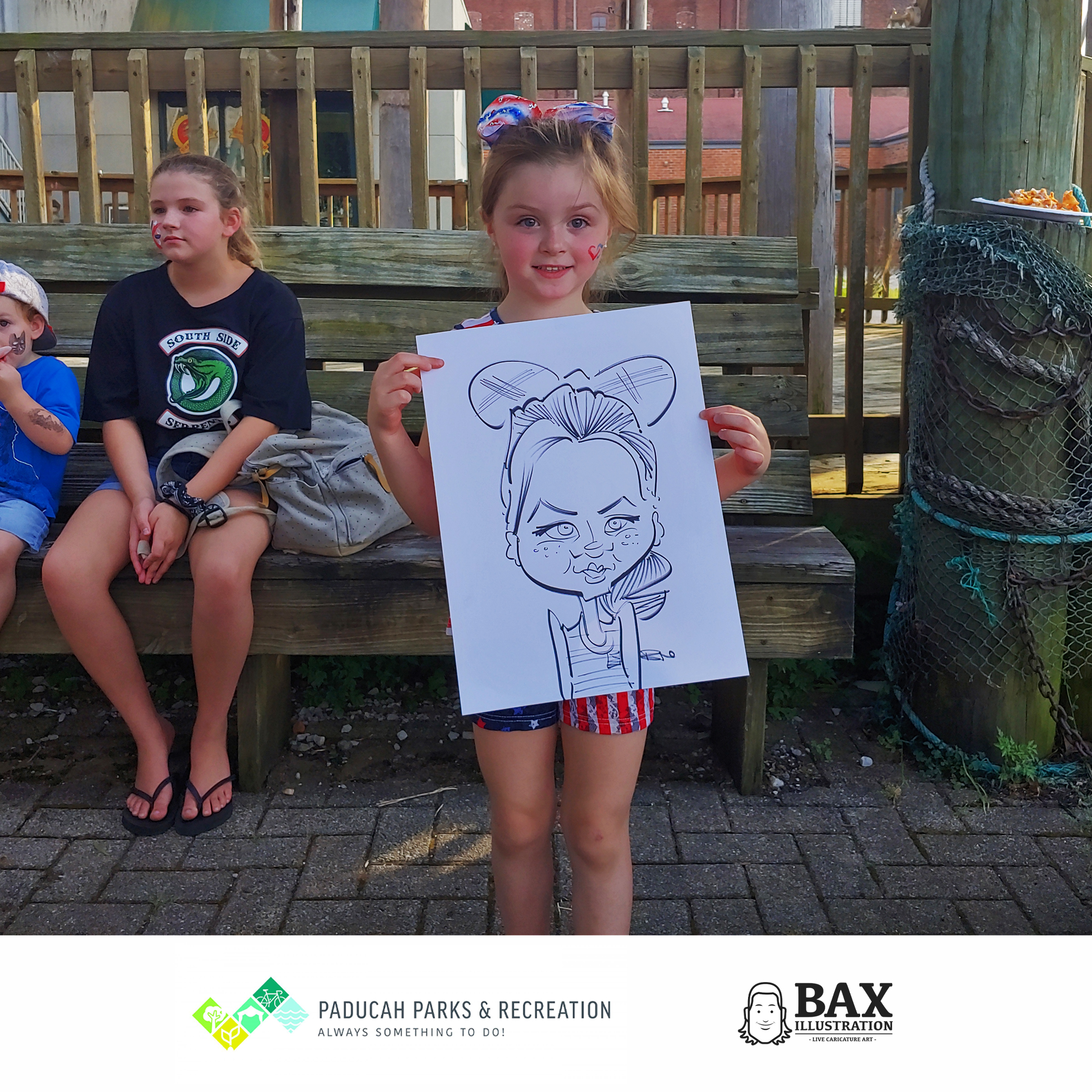 girl holding caricature by Bax Illustration in Paducah Kentucky at the 2019 Independence Day Celebration