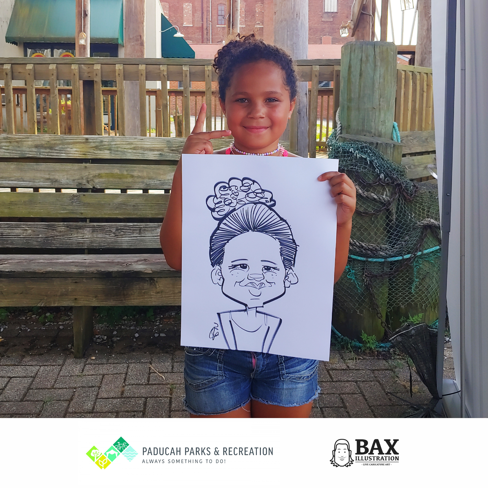 Girl holding caricature by Bax Illustration in Paducah Kentucky at the 2019 Independence Day Celebration