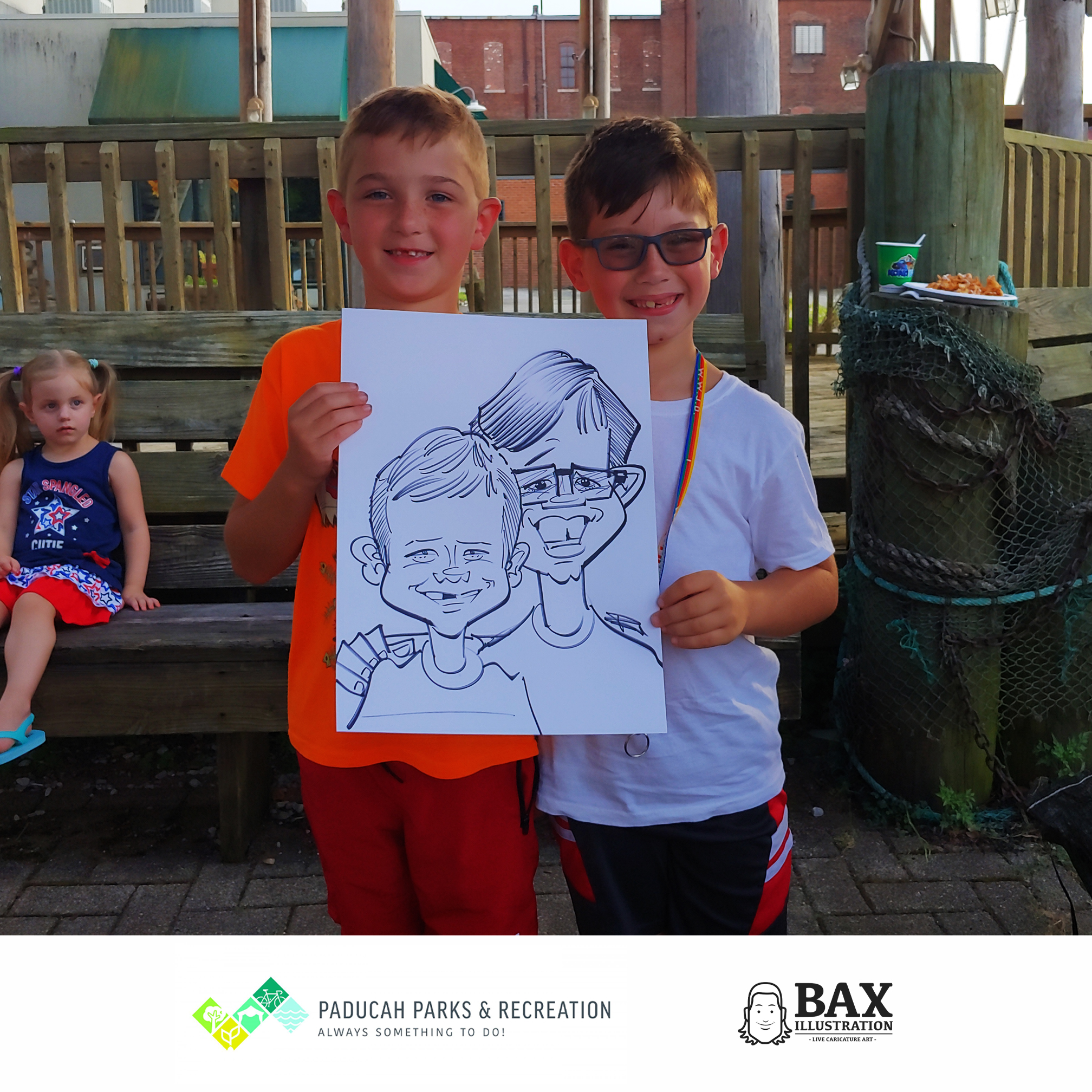 kids holding caricature by Bax Illustration in Paducah Kentucky at the 2019 Independence Day Celebration