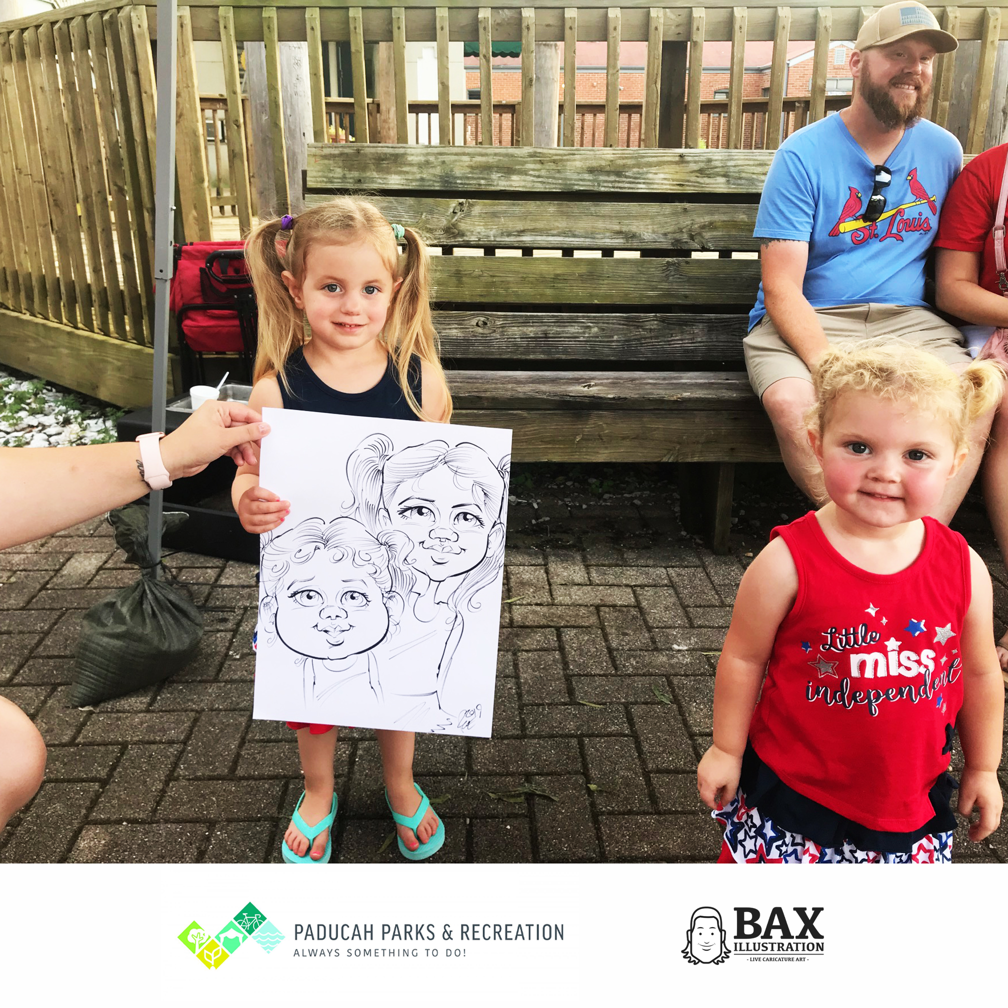 Kids holding caricature by Bax Illustration in Paducah Kentucky at the 2019 Independence Day Celebration